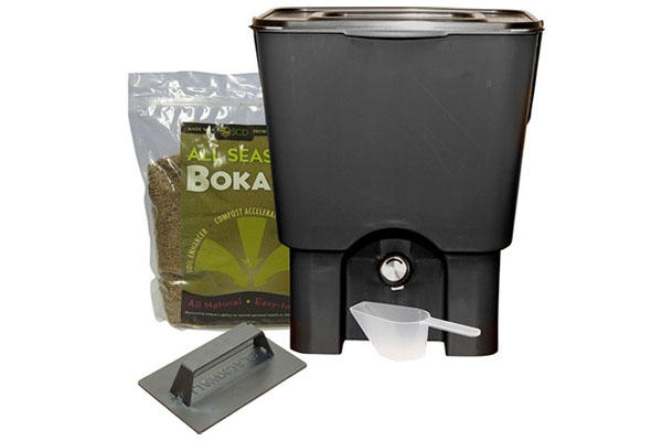A bokashi composting kit, including a bokashi bin and bran.