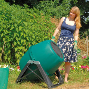 A compost tumbler in a sunny position in the garden